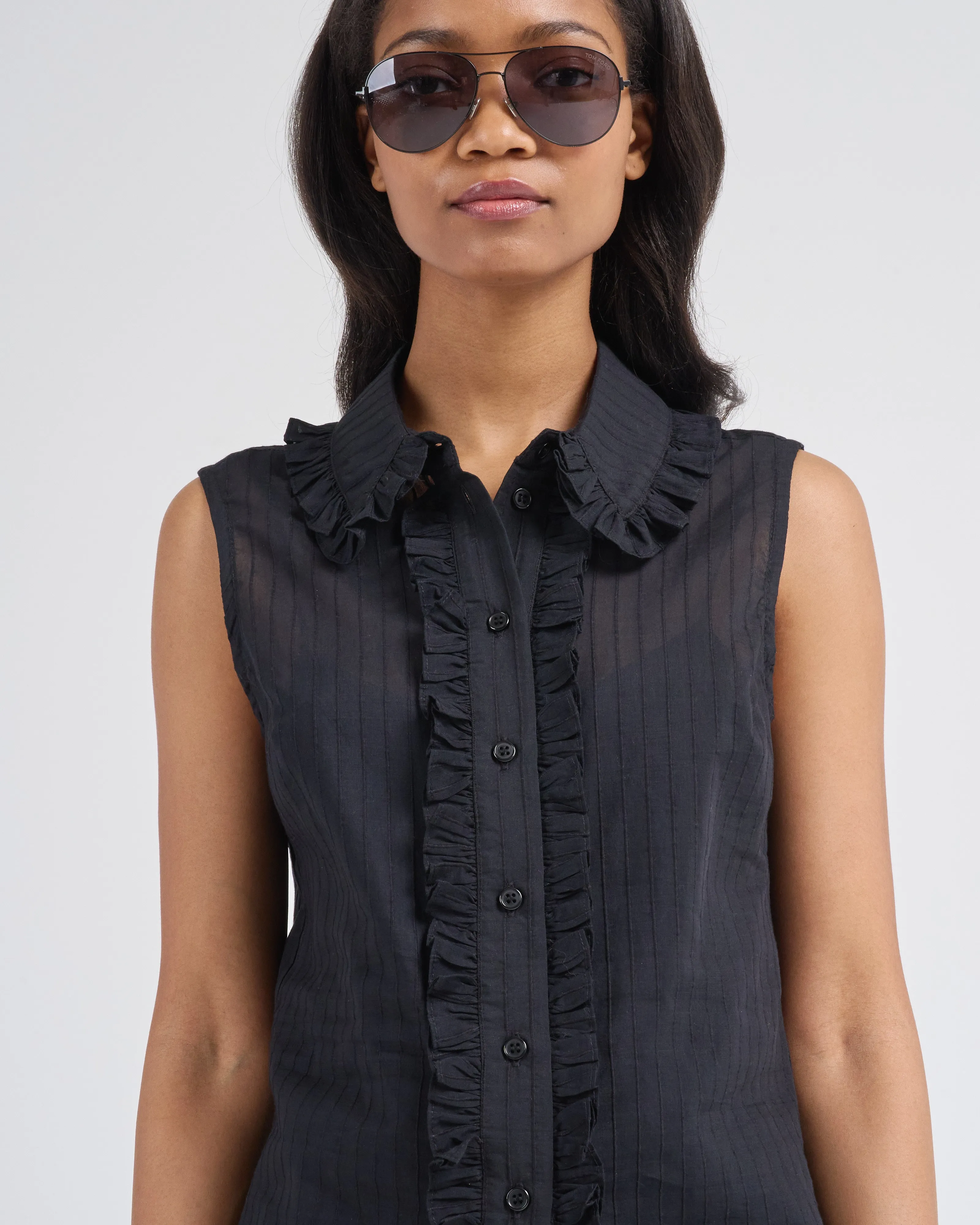sleeveless ruffle trim shirt