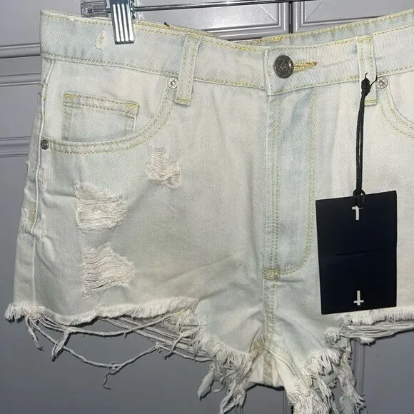 UNIF Distressed light wash cut off denim shorts size 27