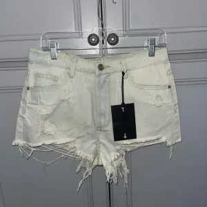UNIF Distressed light wash cut off denim shorts size 27